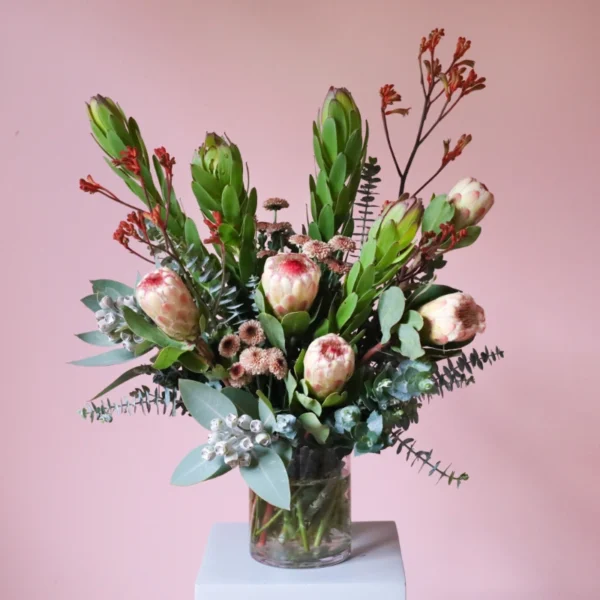 Australian native flower arrangement in vase with kangaroo paw, proteas and leucadendron.